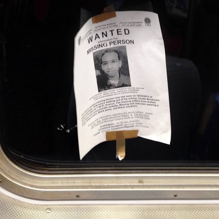 In this Saturday, Oct. 12, 2013 photo, a flyer showing Avonte Oquendo, a missing 14-year-old autistic boy, is taped inside the window of a subway car in New York. New York City police are asking the public to come forward with any possible information about Oquendo, who wandered out of his school in Queens on Oct. 4 and has not been seen since. Hundreds of officers have been searching for the teen, who does not speak. His parents say he loves trains. (AP Photo/Barbara Woike)