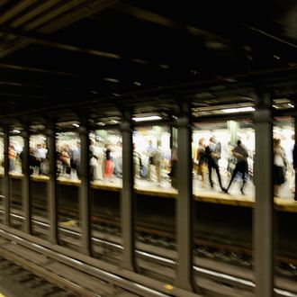 Manhattan, New York City, New York State, USA --- Commuters Waiting for Subway.