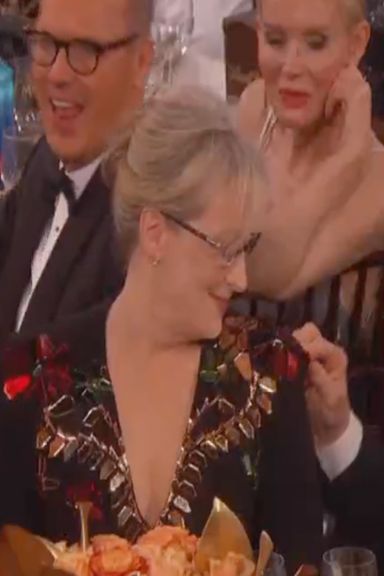 Meryl and her husband have a fairly classic relationship. She brings him to award shows and he follows her around picking lint off her dress, as if he were a mother monkey eating lice out of her babies' hair. He has to eat the lint.