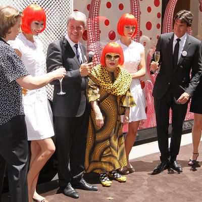 Yayoi Kusama with Louis Vuitton's Yves Carcelle and Jordi Constans.