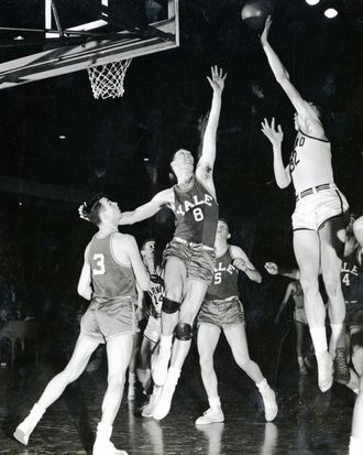 Ed Smith '51 sinks the winning basket to beat Yale, 57-55, at Boston Arena March 3, 1950.