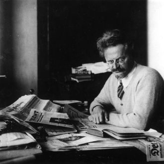 Russian revolutionary Leon Trotsky (1879 - 1940) working on his book 'The History of the Russian Revolution' in his study at Principe, Gulf of Guinea. 