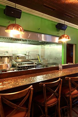 The bar an open kitchen.