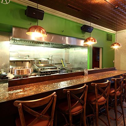 The bar an open kitchen.