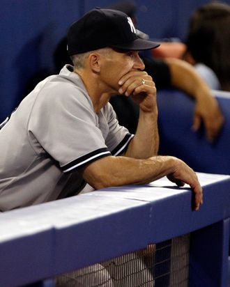 Manager Joe Girardi looks out from the dugout after 7-1 loss against the Toronto Blue Jays.