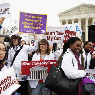  Supporters of the Affordable Care Act gather in front of the U.S Supreme Court during a rally March 4, 2015 in Washington, DC. The Supreme Court was scheduled to hear oral arguments in the case of King v. Burwell that could determine the fate of health care subsidies for as many as eight million people. (Photo by Alex Wong/Getty Images)
