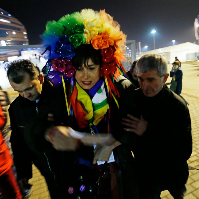 Vladimir Luxuria, a former Communist lawmaker in the Italian parliament and prominent crusader for transgender rights, is detained by police after entering the Shayba Arena at the 2014 Winter Olympics, Monday, Feb. 17, 2014, in Sochi, Russia. (AP Photo/David Goldman)
