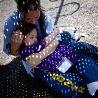 Cali Farmer hugs her mother Netta Farmer at California Institute for Women state prison in Chino