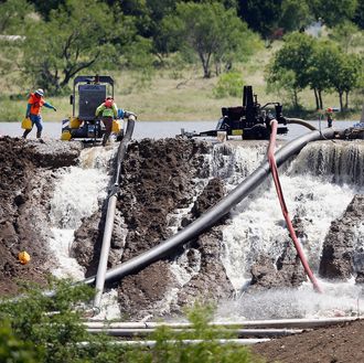 Flood Waters Threaten To Break Dam Outside Of Dallas