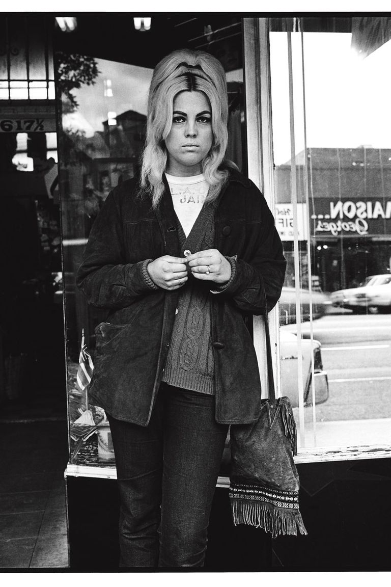 “I photographed two bikers individually and then together. She was begging, and I said, ‘Is she with you? Is she anybody with you?’ One of the guys said, ‘She better be.’ I said, ‘Would you mind if i took her picture?’ He said, ‘Yeah,’ and I went over and took her picture — she’s got so much feeling. There’s kind of depth to her, a sense of somebody who is very actively alive behind those eyes.”