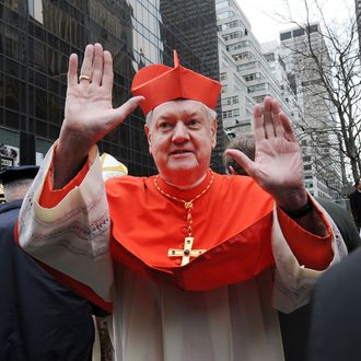 Cardinal Edward Egan waves before Timothy Dolan's Mass of Installation at St. Patrick's Cathedral April 15, 2009 in New York City. Dolan, 59, the former Milwaukee archbishop, is taking over the nation's second-largest diocese from Cardinal Edward Egan who is retiring after nine years. 