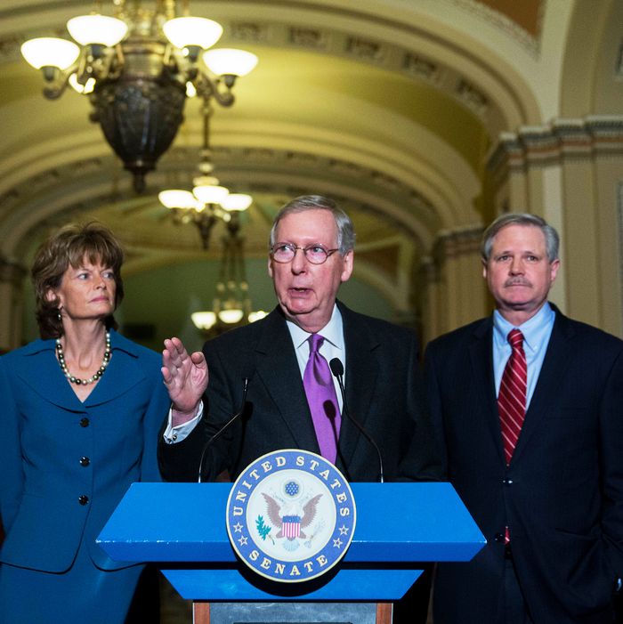 Senate Majority Leader Mitch McConnell, a Republican from Kentucky, center, speaks during a news conference with Senator John Hoeven, a Republican from North Dakota, right, and Senator Lisa Murkowski, a Republican from Alaska, after a cloture vote on the Keystone XL pipeline bill at the U.S. Capitol in Washington, D.C., U.S., on Thursday, Jan. 29, 2015. 