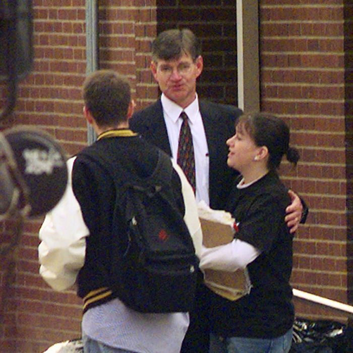 Heath High School principal Bill Bond talks with students arriving on Tuesday, Dec. 2, 1997 in West Paducah, Ky. A 14-year-old freshman boy opened fire Monday during a student prayer group meeting, killing three students and injuring five others. (AP Photo/Mark Humphrey)
