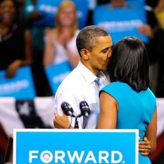 U.S. President Barack Obama gives first lady Michelle Obama a kiss after she introduced him before his speech at a campaign rally at the Virginia Commonwealth University May 5, 2012 in Richmond, Virginia. President Obama officially kicked off his 2012 campaign for reelection today.