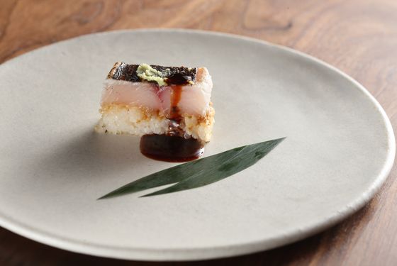 Mackerel Sabazushi &#8212; wasabi, dashi ponzu. Gray uses Dave Arnold&#8217;s new invention, the Searzall, to sear the top of the fish in the mackerel sabazushi, as well as toast the rice.
