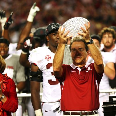 Head coach Nick Saban of the Alabama Crimson Tide celebrates with the BCS Coaches' Trophy as his wife Terry looks on after defeating the Notre Dame Fighting Irish in the 2013 Discover BCS National Championship game at Sun Life Stadium on January 7, 2013 in Miami Gardens, Florida. Alabama won the game by a score of 42-14.