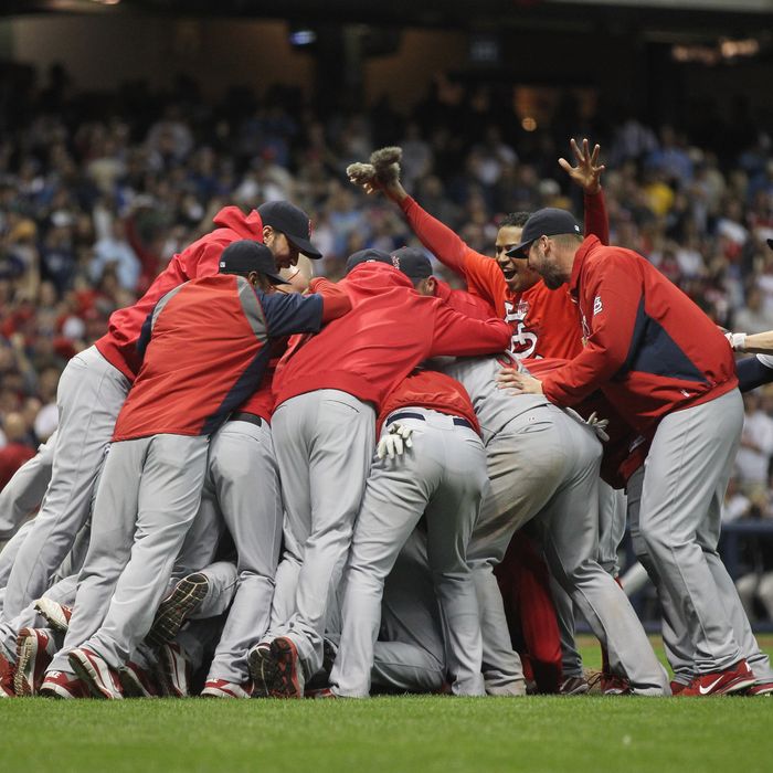 MILWAUKEE, WI - OCTOBER 16: The St. Louis Cardinals celebrate after they won 12-6 against the Milwaukee Brewers during Game Six of the National League Championship Series at Miller Park on October 16, 2011 in Milwaukee, Wisconsin. (Photo by Jonathan Daniel/Getty Images)