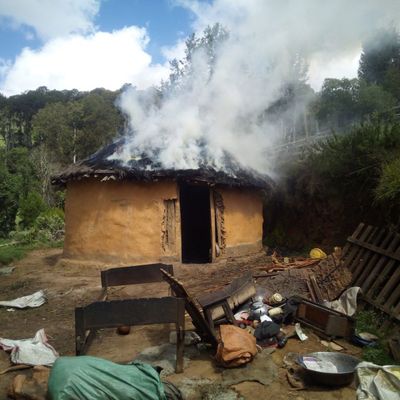 A Sengwer cottage burns, lit on fire by the Kenyan military.