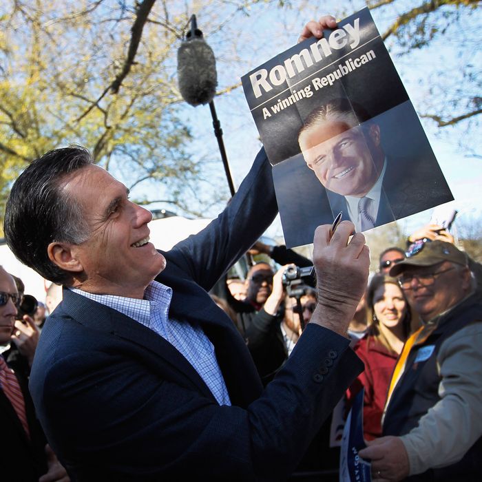 SPARTANBURG, SC - JANUARY 18: Republican presidential candidate and former Massachusetts Gov. Mitt Romney holds up a poster of his father, George Romney, who was the former governor of Michigan, after it was given to him while greeting people at a campaign rally at Wofford College on January 18, 2012 in Spartanburg, South Carolina. Romney continues to campaign for votes in South Carolina ahead of their primary on January 21. (Photo by Joe Raedle/Getty Images)