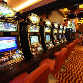 A row of slot machines await gamblers at the opening of Singapore's first casino, the Resorts World Sentosa complex, in Singapore on February 14, 2010. Singapore's first casino opened for business when the first punter was allowed into the gaming section of Resorts World Sentosa complex. The opening -- to be followed within months by a second casino resort -- is part of a multi-billion-dollar effort to transform Singapore's tourism industry. 