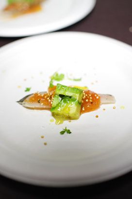 Delicatessen's Spanish-mackerel crudo with roasted-tomato vinaigrette, avocado, and crispy quinoa.