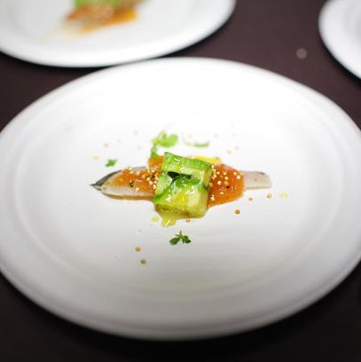 Delicatessen's Spanish-mackerel crudo with roasted-tomato vinaigrette, avocado, and crispy quinoa.
