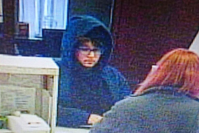Woman Robs Bank Woman Robs Bank in Drawn-on Facial Hair