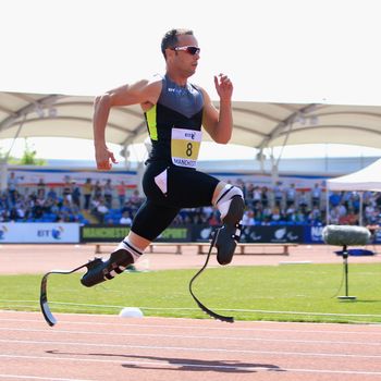 Oscar Pistorius of South Africa on his way to victory in the men's T42/43/44 200m during day one of the BT Paralympic World Cup at Sportcity on May 22, 2012 in Manchester, England.
