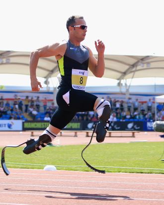 Oscar Pistorius of South Africa on his way to victory in the men's T42/43/44 200m during day one of the BT Paralympic World Cup at Sportcity on May 22, 2012 in Manchester, England.