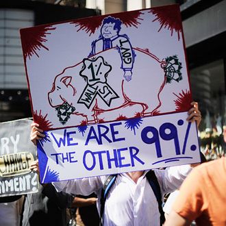 LOS ANGELES, CA - OCTOBER 01: Protesters hold signs as they march to Los Angeles City Hall during the 