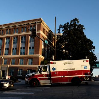 OMAHA, NEBRASKA - OCTOBER 6: An ambulance carrying an American freelance cameraman who contracted Ebola in Liberia, Ashoka Mukpo, arrives at the Nebraska Medical Center October 6, 2014 in Omaha, Nebraska. Mukpo is the fifth American diagnosed with Ebola and is reported to be in good spirits. (Photo by Eric Francis/Getty Images)