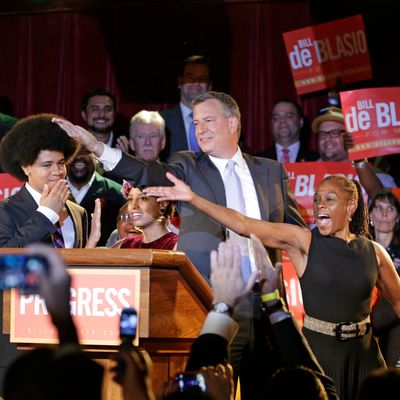 New York City Democratic Mayoral candidate Bill De Blasio his wife Chirlane, right, and son Dante, left, dances the 