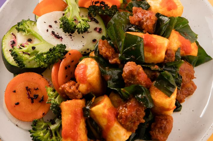 Spicy Korean rice cakes with sausage and Chinese broccoli.