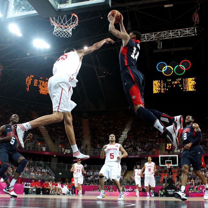 Anthony Davis #14 of United States dunks the ball over Salah Mejri #15 of Tunisia during the Men's Basketball Preliminary Round match on Day 4 of the London 2012 Olympic Games at Basketball Arena on July 31, 2012 in London, England. 