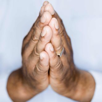 Edmonds, Washington State, USA --- African American man's hands in prayer position.