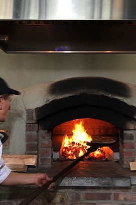 A pie's about to come out of the oven.