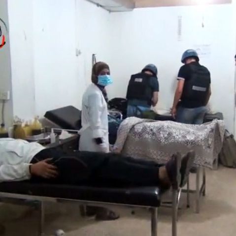 An image grab taken from a video uploaded on YouTube on August 26, 2013 allegedly shows a UN inspectors (C) visiting a hospital in the Damascus suburb of Moadamiyet al-Sham. UN inspectors reached a site near Syria's capital of a suspected chemical weapons attack to launch an investigation, meeting doctors and casualties. 