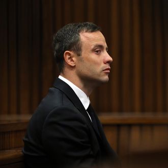 South African Paralympic track star Oscar Pistorius attends his trial in Court in Pretoria on April 7, 2014. As the defence opens its case, the 27-year-old Paralympian will give the court his first account of why he shot dead his model girlfriend Reeva Steenkamp in the early hours of Valentine's Day in 2013. 