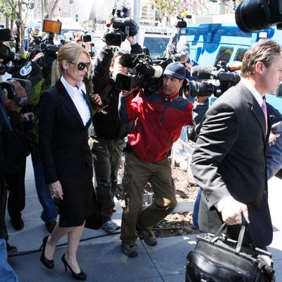 Nicollette Sheridan is quiet to the media as she leaves the courthouse after the case ends in a mistrial. 