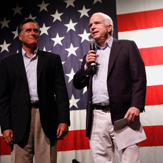 MESA, AZ - JUNE 4: U.S. Sen. John McCain (R-AZ) (R) is joined by former Massachusetts governor Mitt Romney as he speaks during a town hall meeting during a campaign stop at Mesa High School on June 4, 2010 in Mesa, Arizona. McCain, who is seeking a fifth term in the Senate, will challenge former congressman and radio personality J.D. Hayworth during the primary. (Photo by Joshua Lott/Getty Images)