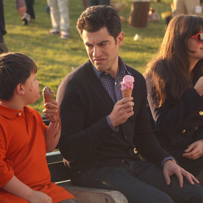 NEW GIRL: Schmidt (Max Greenfield, C) can't enjoy a day at the beach with Jess (Zooey Deschanel, R), when he becomes distracted by a messy little boy (guest star Lukas Martin, L) eating ice cream next to him in the 