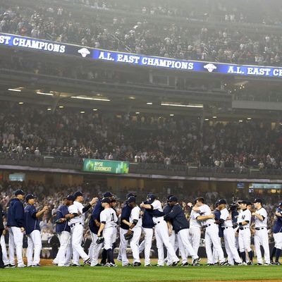 The New York Yankees celebrate the 14-2 win over the Boston Red Sox on October 3, 2012 at Yankee Stadium in the Bronx borough of New York City. With the win, the New York Yankees clinch the A.L. East Division title.