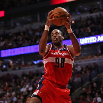 CHICAGO, IL - APRIL 17: Jason Collins #98 of the Washington Wizards rebounds against the Chicago Bulls at the United Center on April 17, 2013 in Chicago, Illinois. The Bulls defeated the Wizards 95-92. NOTE TO USER: User expressly acknowledges and agrees that, by downloading and or using this photograph, User is consenting to the terms and conditions of the Getty Images License Agreement. (Photo by Jonathan Daniel/Getty Images) *** Local Caption *** Jason Collins