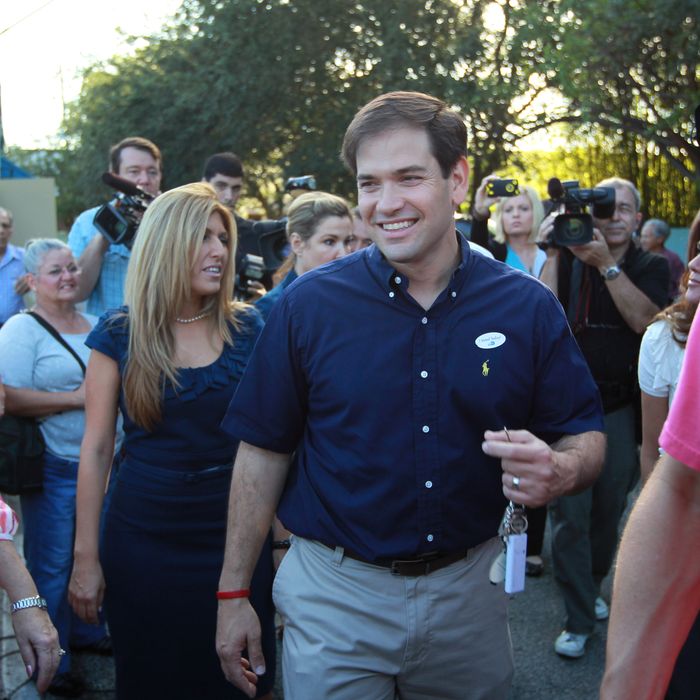 Marco Rubio, Republican candidate for Florida's U.S. Senate seat, walks with his wife, Jeanette Rubio after casting his vote November 2, 2010 in West Miami, Florida.