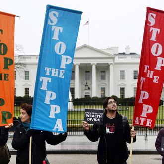  Activists hold a rally to protest the Trans-Pacific Partnership (TPP) in front of the White house on February 3, 2016 in Washington, DC. The TPP trade pact is expected to be signed in New Zealand on February 4. 