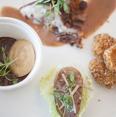 Leah Cohen's Filipino-inspired dishes including Dinuguan (blood stew), crispy pata, fermented sausage, and a spicy chicarron.