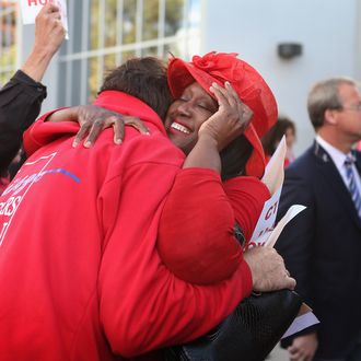 CHICAGO, IL - SEPTEMBER 18: Chicago Teachers Union (CTU) delegates embrace after voting to end their strike on September 18, 2012 in Chicago, Illinois. More than 26,000 Chicago Public school teachers and support staff walked off the job on September 10 after the union failed to reach an agreement with the city on compensation, benefits and job security. With about 350,000 students, the Chicago school district is the third largest in the United States. Students will return to school tomorrow. (Photo by Scott Olson/Getty Images)