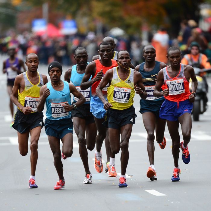 Runners race in the New York City Marathon on November 3, 2013. Geoffrey Mutai (R) of Kenya won the race in the men's division with a time of 02:08:24.