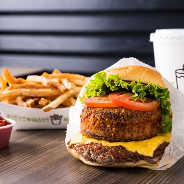 Pictured here: Hand-cut fries and the Shack Stack, large and in charge. All aboard; choo-choo.