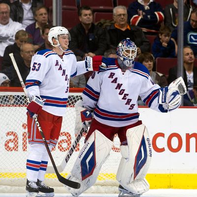 VANCOUVER, CANADA - OCTOBER 18: Goalie Henrik Lundqvist #30 of the New York Rangers is congratulated by teammate Tim Erixon #53 after shutting out the Vancouver Canucks during NHL action on October 18, 2011 at Rogers Arena in Vancouver, British Columbia, Canada. (Photo by Rich Lam/Getty Images)